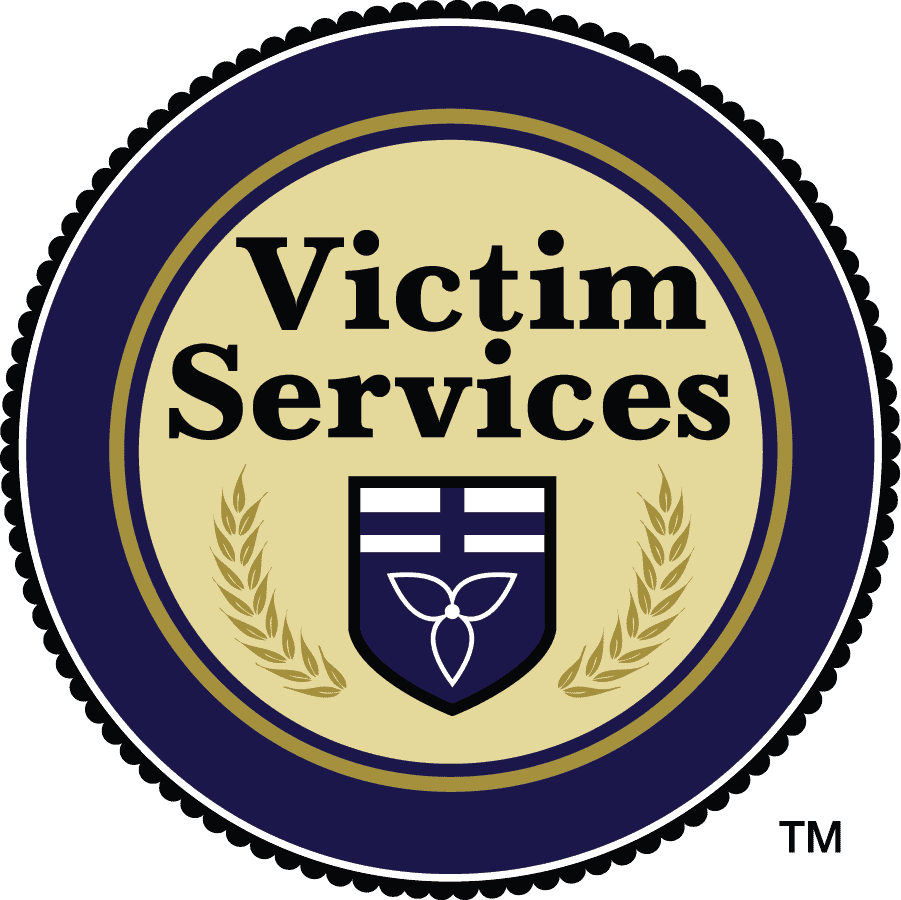 Victim services of peterborough & northumberland logo, emblem, or badge with text, shield, and laurel wreath.
