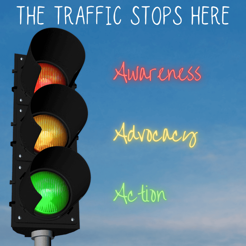 Traffic light with red, yellow, and green signals showing, symbolizing awareness, advocacy, and action; promoting traffic safety and community awareness.